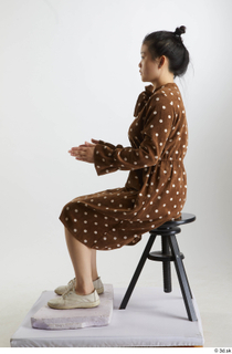 Aera  1 brown dots dress casual dressed sitting white…